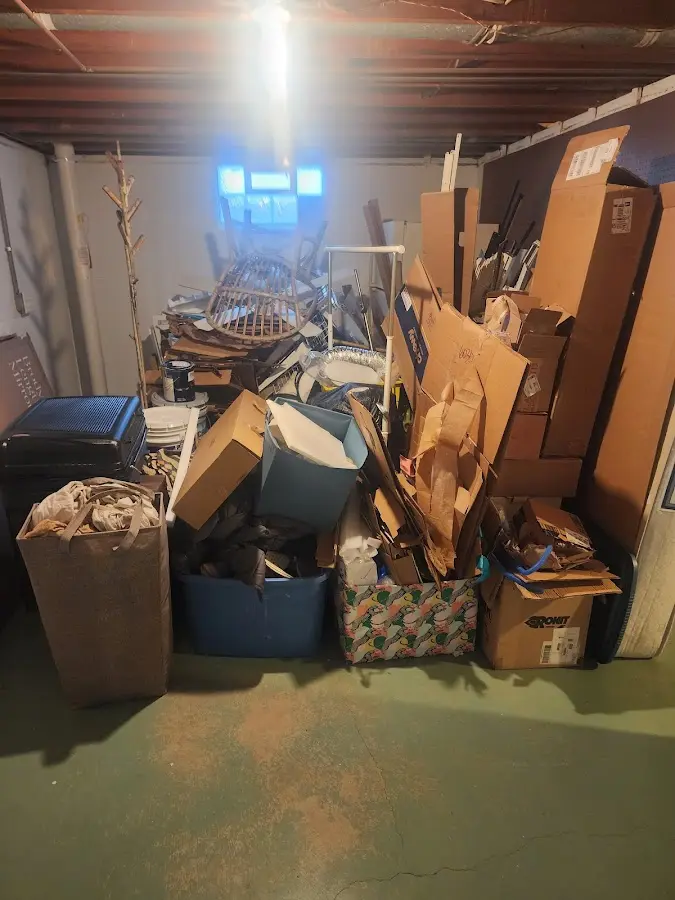 Roll-off dumpster container at job site for 6 Yard Dumpster Rental in Brush